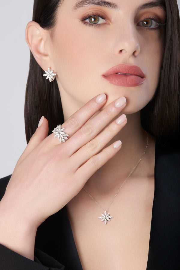 Necklace, ring and earrings in 18k White Gold with White Diamonds on model wearing a black shirt.