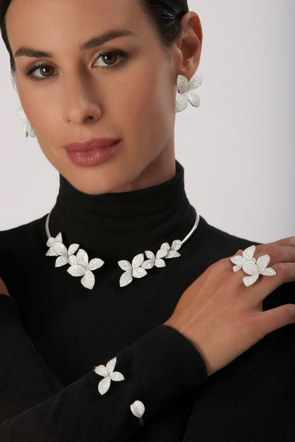 Bracelet, earrings, collier and ring in 18k White Gold with Diamonds on model wearing a black turtleneck