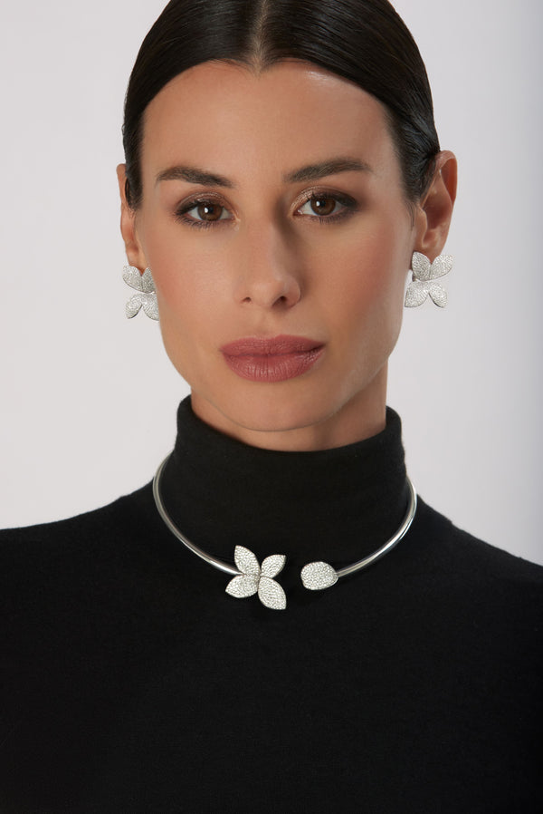 Collier and earrings in 18k White Gold with Diamonds on model wearing black turtleneck.
