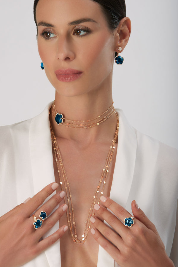 Multi Chain Sautoir, rings and earrings in 18k Rose Gold with London Blue Topaz and Diamonds on model wearing a white shirt