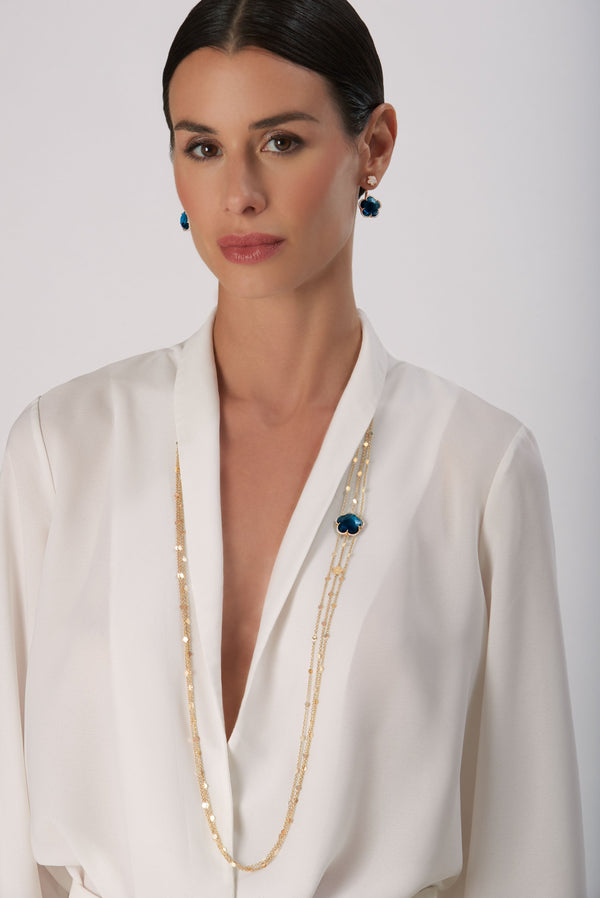 Multi Chain Sautoir and earrings in 18k Rose Gold with London Blue Topaz and Diamonds on model wearing a white shirt