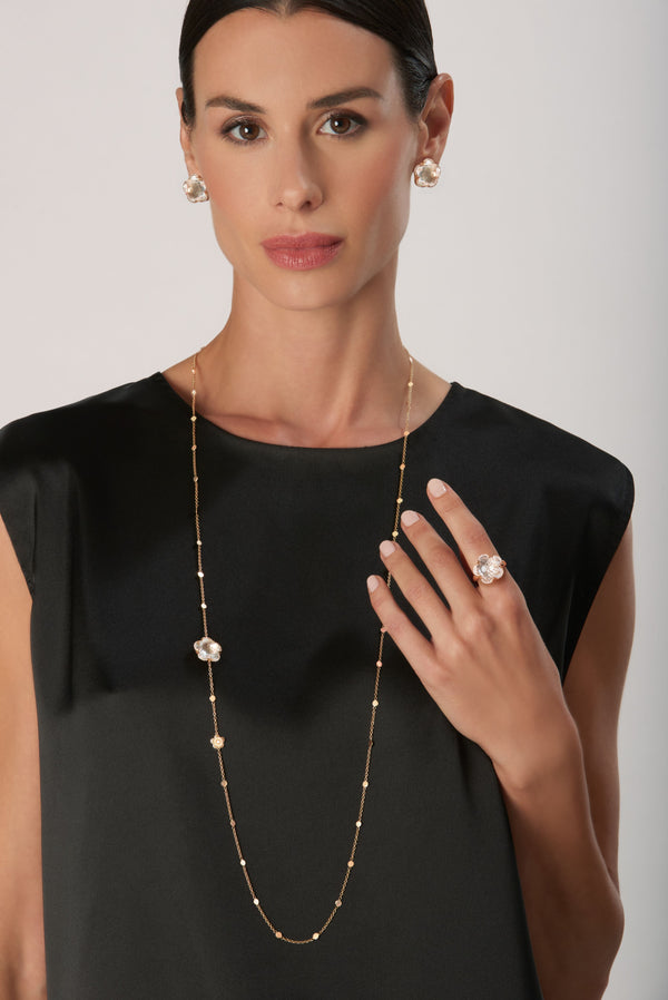 Sautoir, earrings and ring in 18k Rose Gold with Rock Crystal, White and Champagne Diamonds on model wearing black blouse