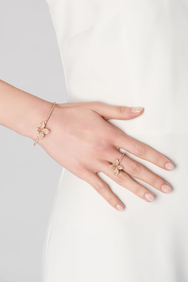 Bracelet and ring in 18k white gold with diamonds on model wearing white dress