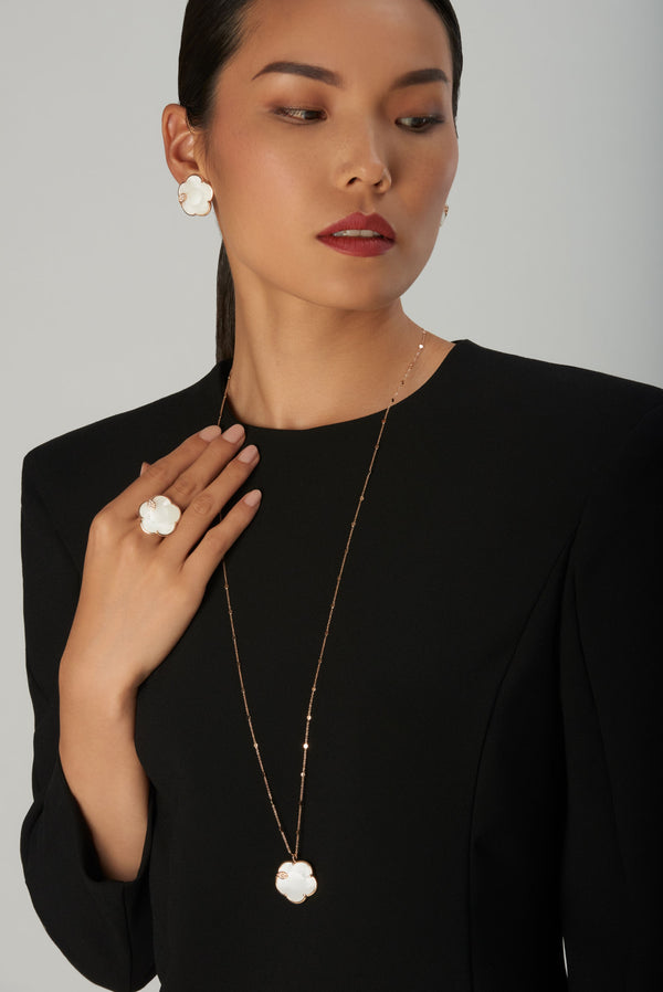 Lariat necklace, ring and earrings in 18k rose gold with white agate and mother of pearl doublet and diamonds on model in black dress