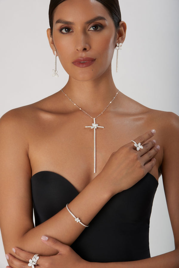 Model wearing necklace, earrings, rings, and bracelet in 18k white gold with diamonds from Pasquale Bruni's Heart to Earth collection.