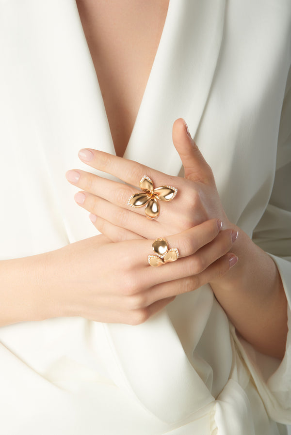 18 carat rose gold rings with leaves and white diamonds on the model