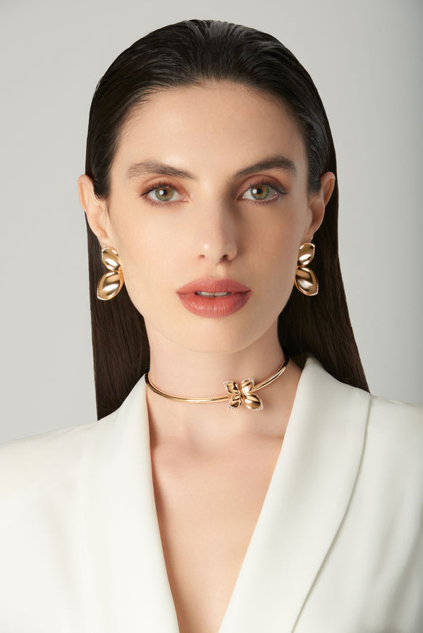 Choker and earrings in 18k rose gold with diamonds on model in white blazer