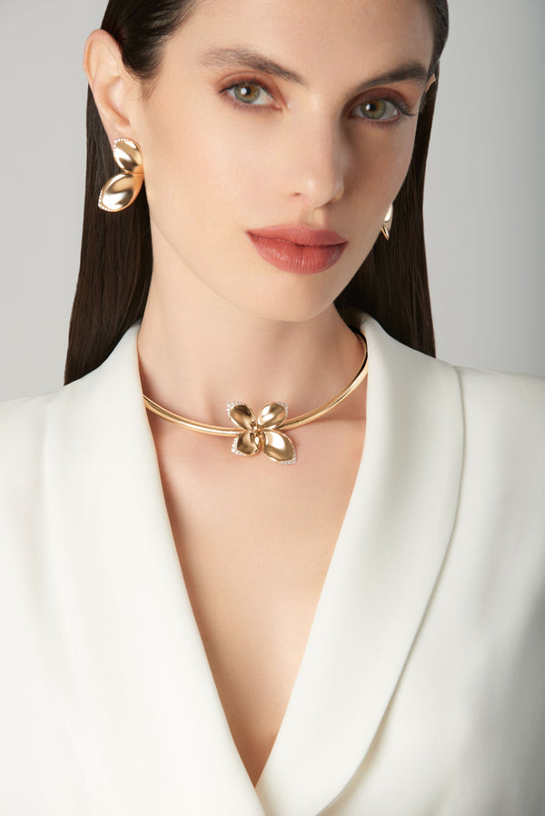 18k rose gold earrings and choker with diamonds from the Secret Gardens collection, worn by a model with a white blazer