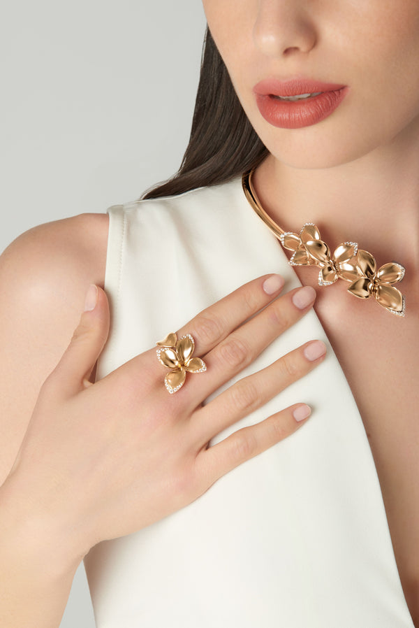 Necklace and ring in 18k rose gold with diamonds on model in white dress