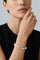 model wearing a Bracelet in 18k White Gold with White Diamonds with a black shirt