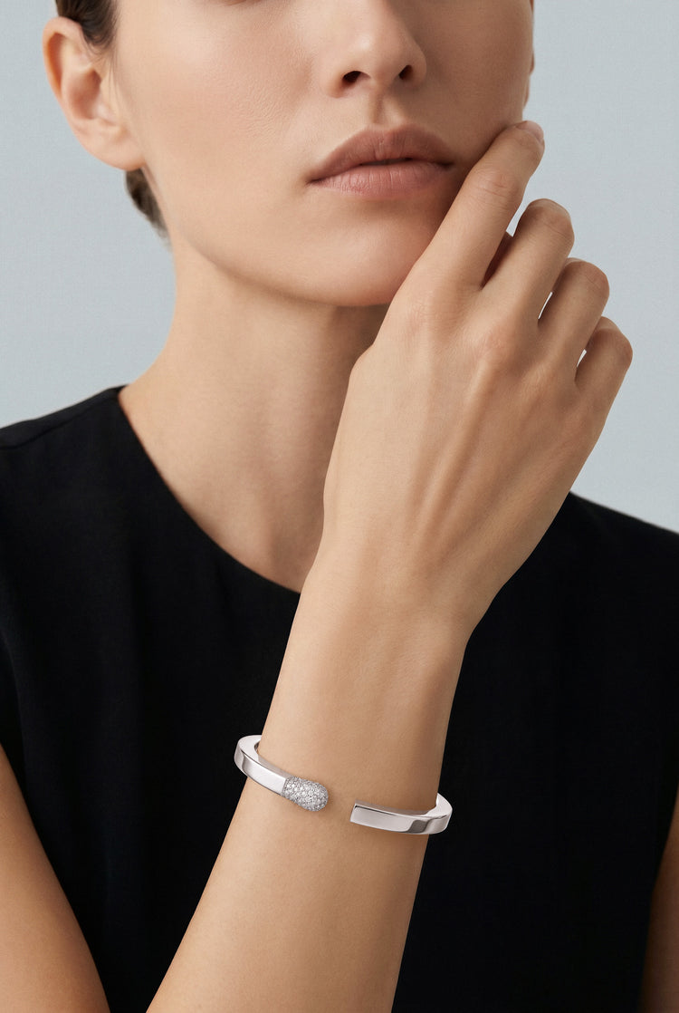 model wearing a Bracelet in 18k White Gold with White Diamonds with a black shirt