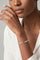 Model wearing a Bracelet in 18k White Gold with Diamonds and a white shirt