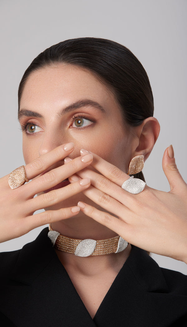 Choker and earrings in 18k white and rose gold with diamonds on model in black attire