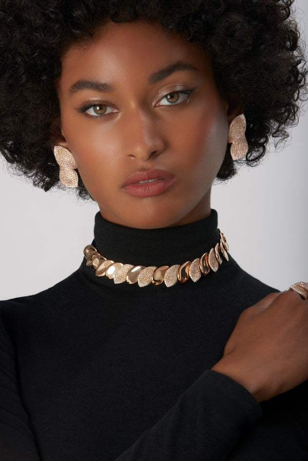 Choker Combination and earrings in 18k Rose Gold with White and Champagne Diamonds on model wearing black turtleneck.