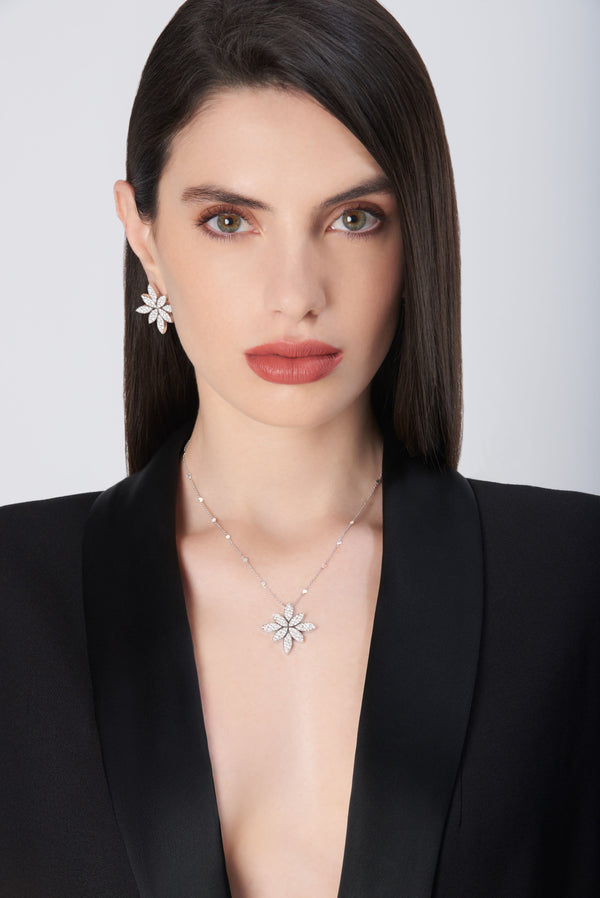 Necklace and earrings in 18k White Gold with White Diamonds on model wearing a black jacket