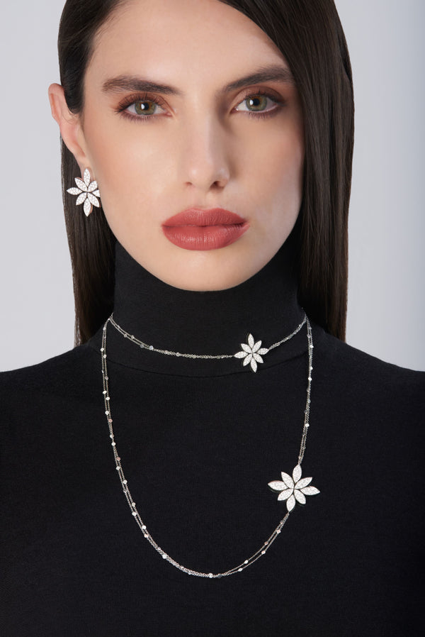 Sautoir and earrings in 18k White Gold with White Diamonds on model wearing black turtleneck