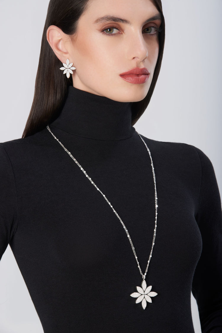 Necklace and earrings in 18k White Gold with White Diamonds on model wearing a black jacket