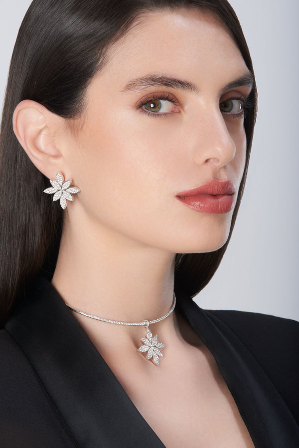 Earrings and choker in 18k white gold with diamonds, worn by model in black jacket
