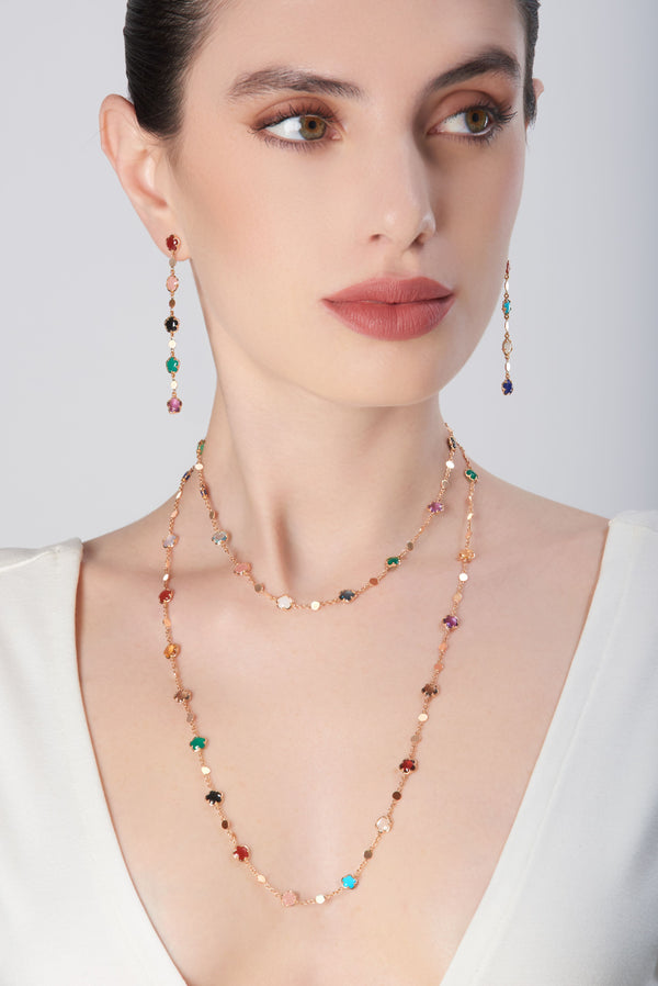 Necklace and dangle earrings in 18k rose gold with multicolored gemstones on model