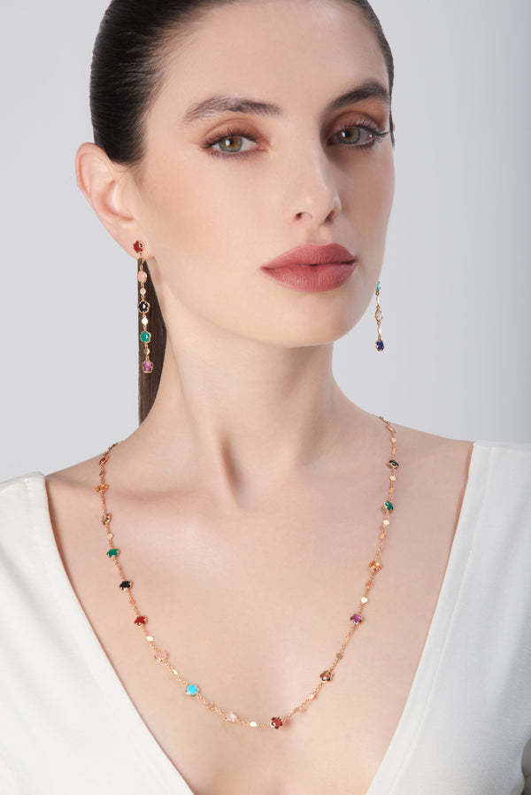 Necklace and pendant earrings in 18k rose gold with gemstones and diamonds on model