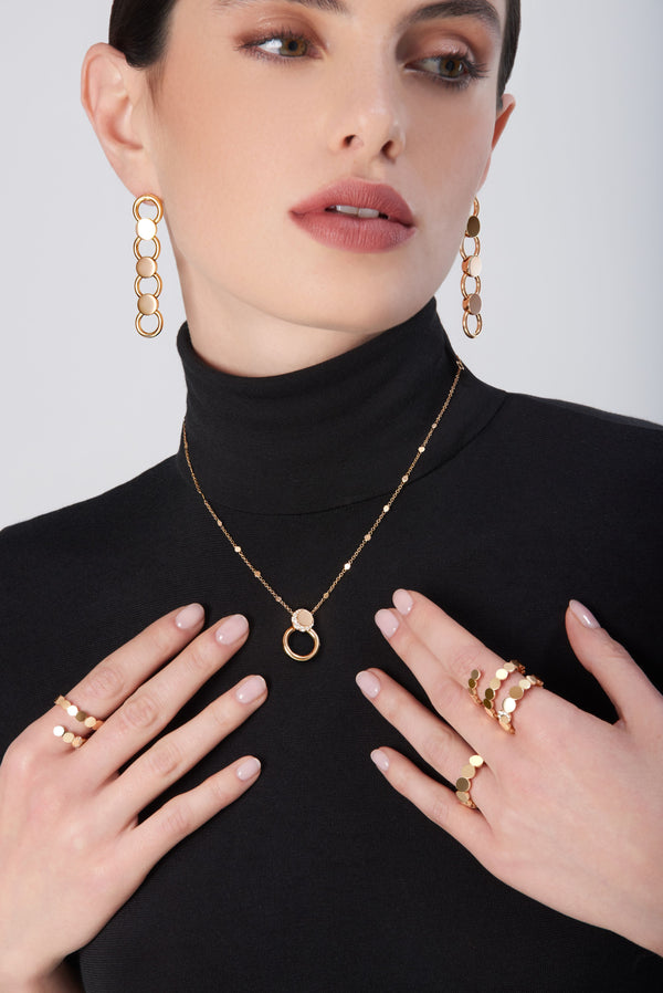 Jewelry set from the Luce collection in 18-karat rose gold worn by model