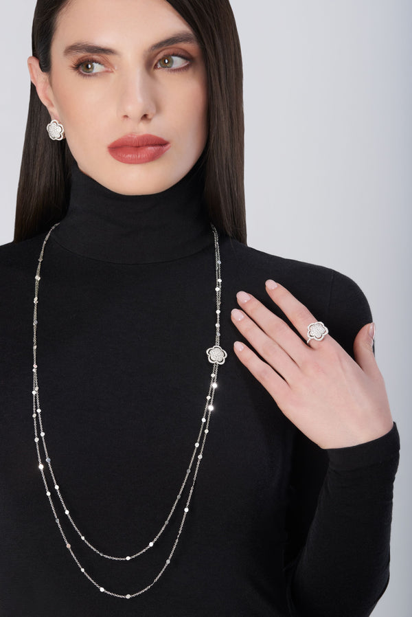 Lariat necklace, earrings, and ring in 18k gold with diamonds on model