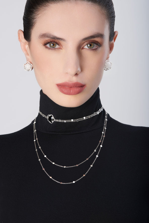 Stud earrings and sautoir necklace in 18k White Gold with Onyx and White Diamonds showcased on model
