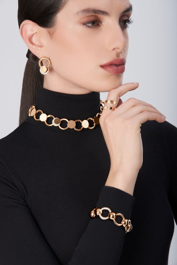 Jewelry set: bracelet, choker, necklace and ring in 18k gold with diamond accents on model