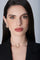 Model wearing a black jacket and earrings and choker in 18k Rose Gold with Diamonds