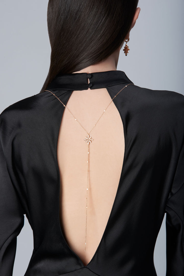 Model wearing a black dress and Sautoir in 18k Rose Gold with Diamonds