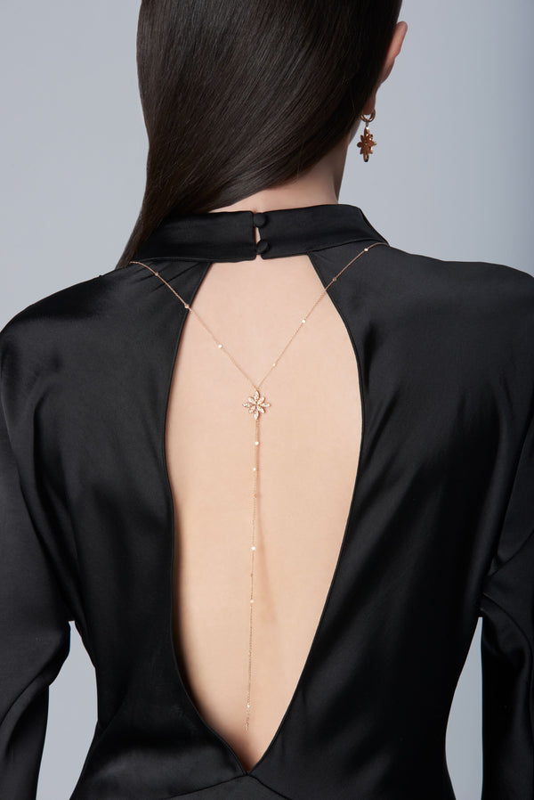 Model wearing a black dress and Sautoir in 18k Rose Gold with Diamonds