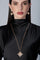 Model wearing a black dress and earrings and becklace in 18k Rose Gold with Diamonds
