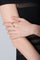 Ring in 18k Rose Gold with Diamonds on model with a black dress