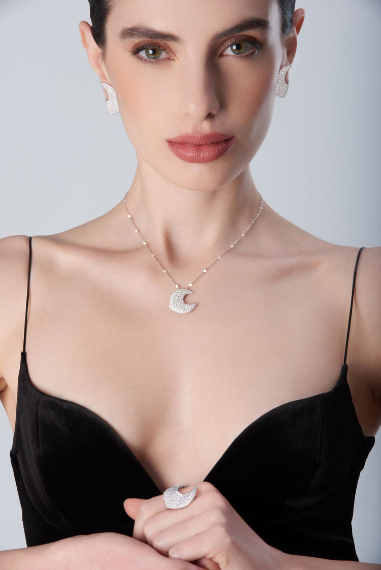 Woman wearing a black choker and earrings18k White Gold with White Diamonds, Small Size.