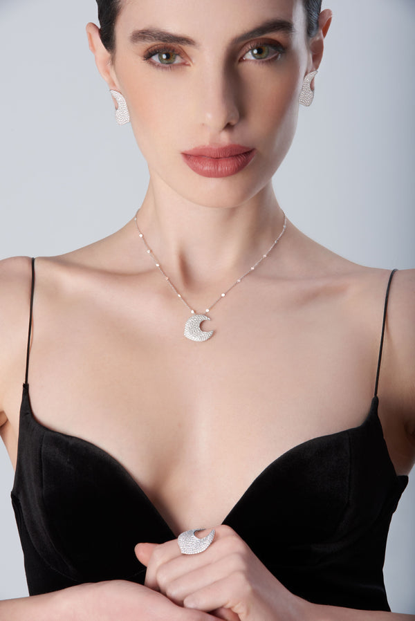 Woman wearing a black choker and earrings18k White Gold with White Diamonds, Small Size.
