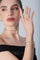 Combination of ring, bracelet, choker in 18k Rose Gold with Diamonds on model wearing a black dress
