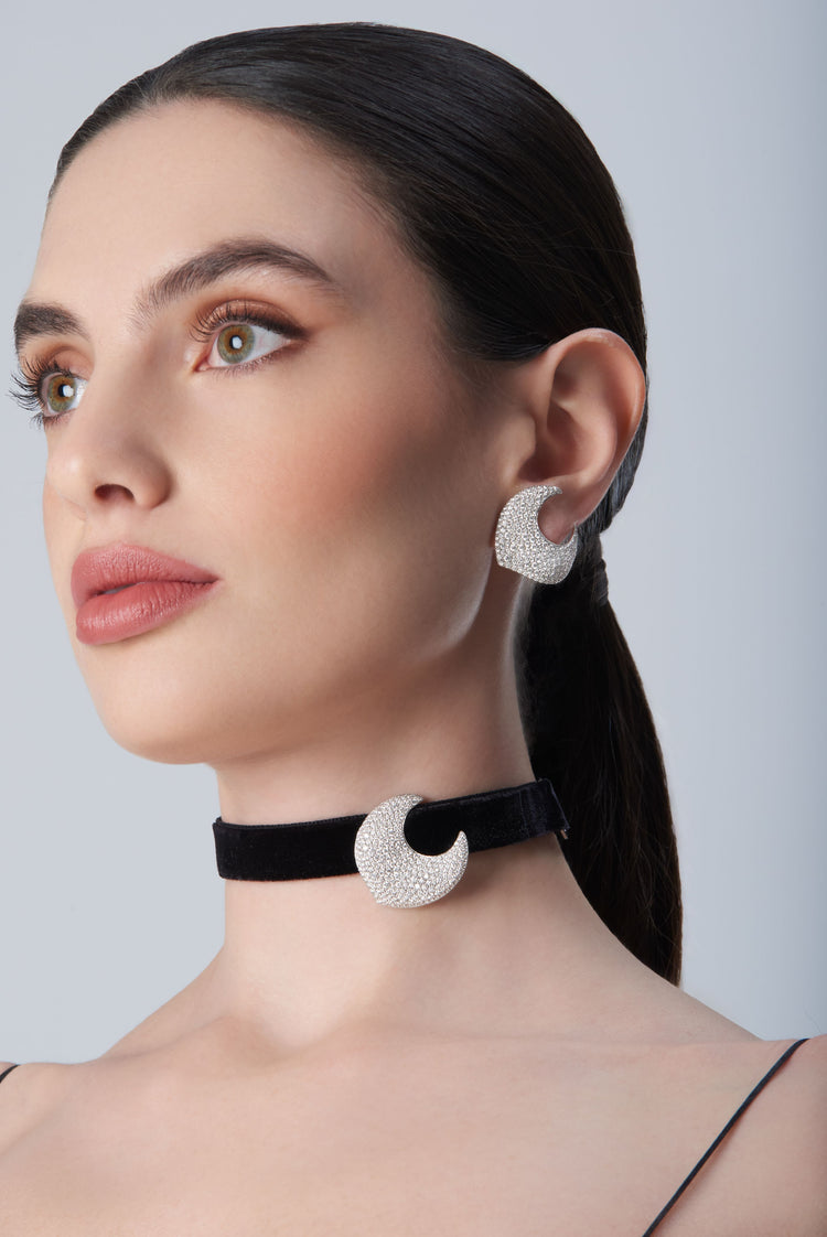 Woman wearing diamond earrings and black velvet choker in 18k White Gold with white diamonds