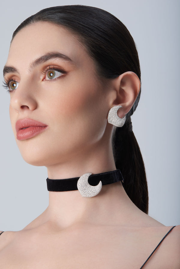 Woman wearing diamond earrings and black velvet choker in 18k White Gold with white diamonds
