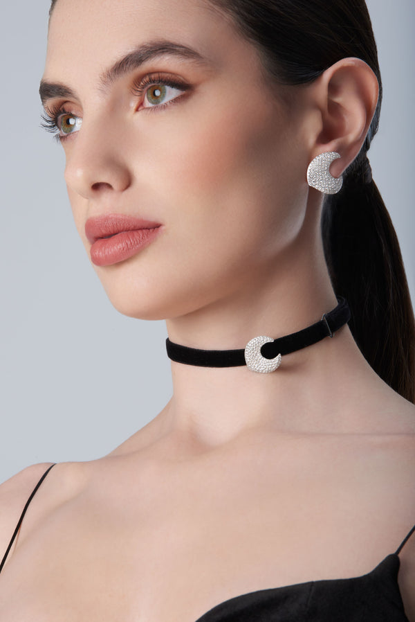 Woman wearing a black choker and earrings18k White Gold with White Diamonds, Small Size.