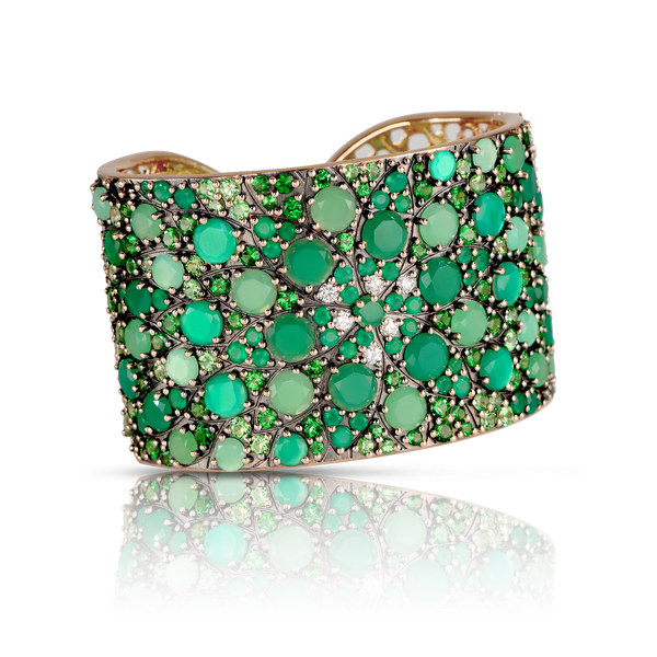 Bangle Bracelet with diamonds and green gemstones.