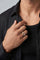 Model wearing a 18k rose gold and grey titanium and a black shirt
