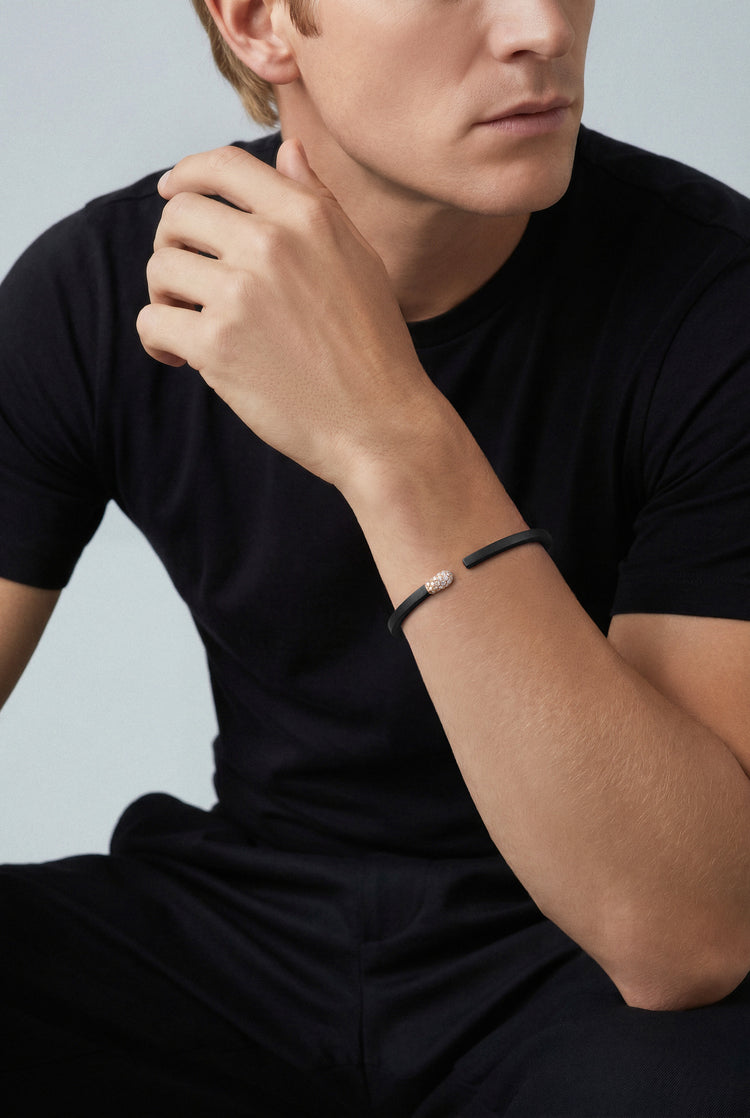 Model with a black tshirt wearing a Bracelet in 18k Rose Gold and Black titanium with white and champagne diamonds