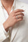 Model wearing a Ring in 18k White Gold and White Diamonds and a total white suit