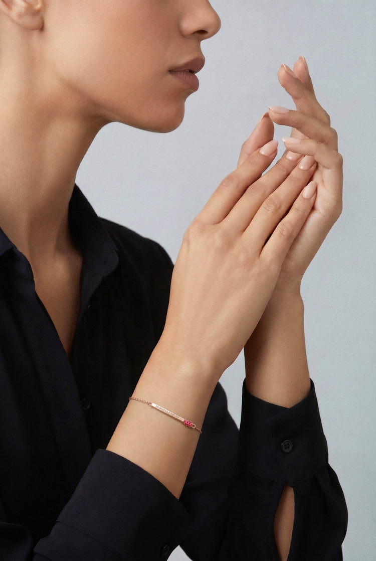 Model wearing a Bracelet in 18k rose gold with rubies and black shirt