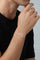 Model wearing a black tshirt and a Bracelet in 18k White gold with white diamonds