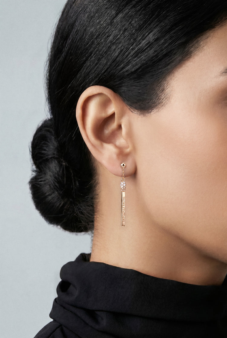 Model wearing a black shirt and Earrings in 18k White gold with white and champagne diamonds