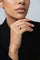 Model wearing a Ring in 18k Rose Gold an Black Titanium with White and Champagne Diamonds with a black shirt.