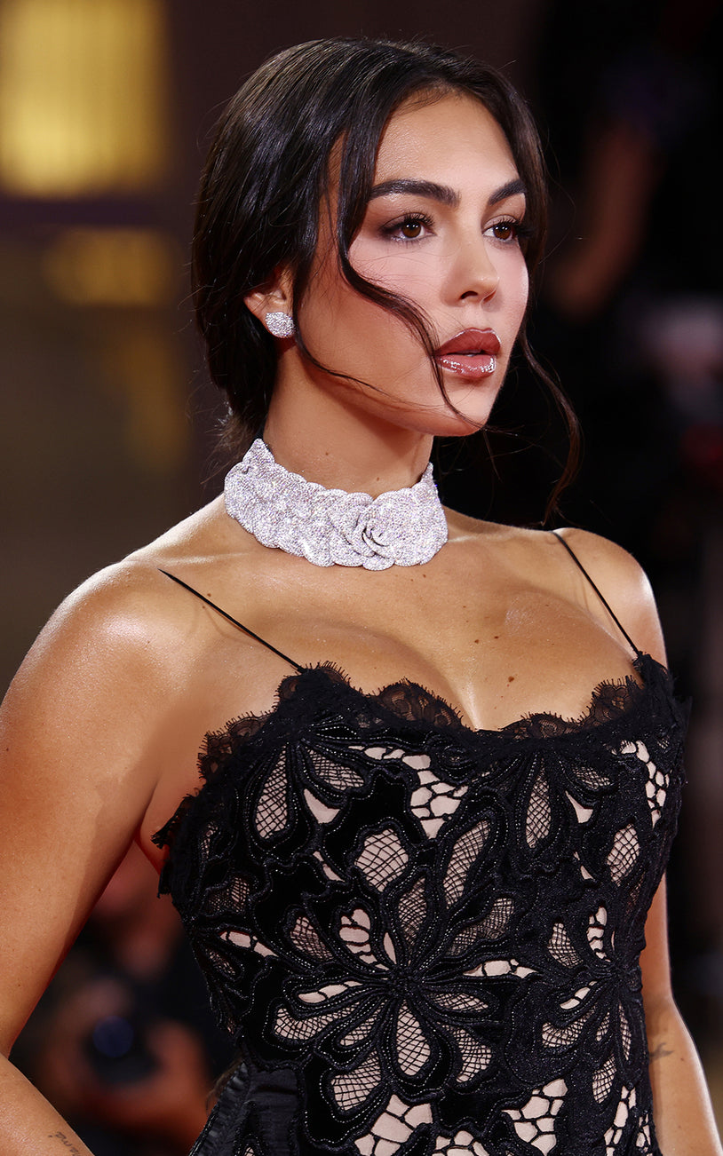 Georgina Rodriguez with a black dress wearing our choker and earrings in 18k White Gold with White Diamonds.