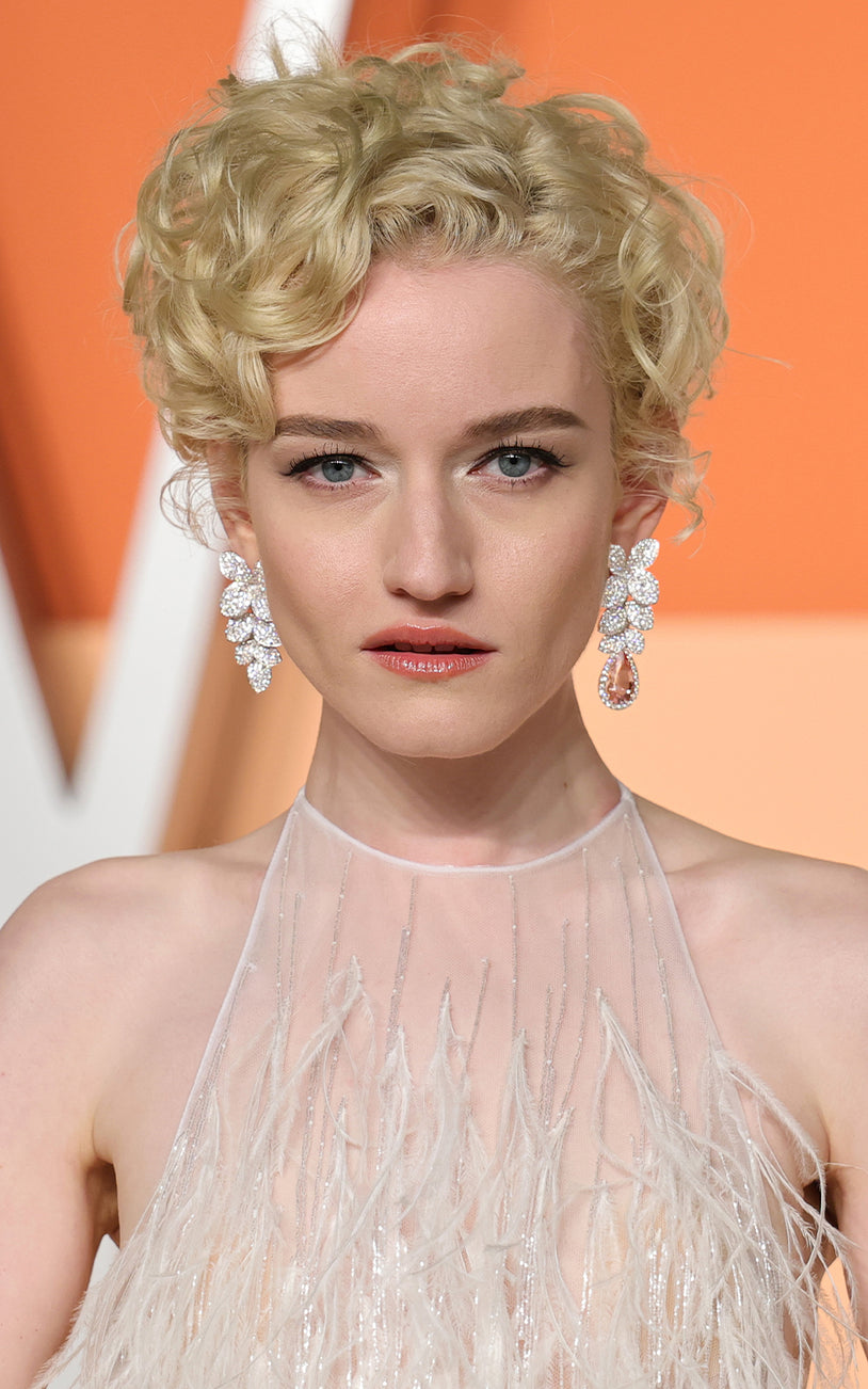 Julia Garner wearing our earrings in 18k White Gold with white diamonds.