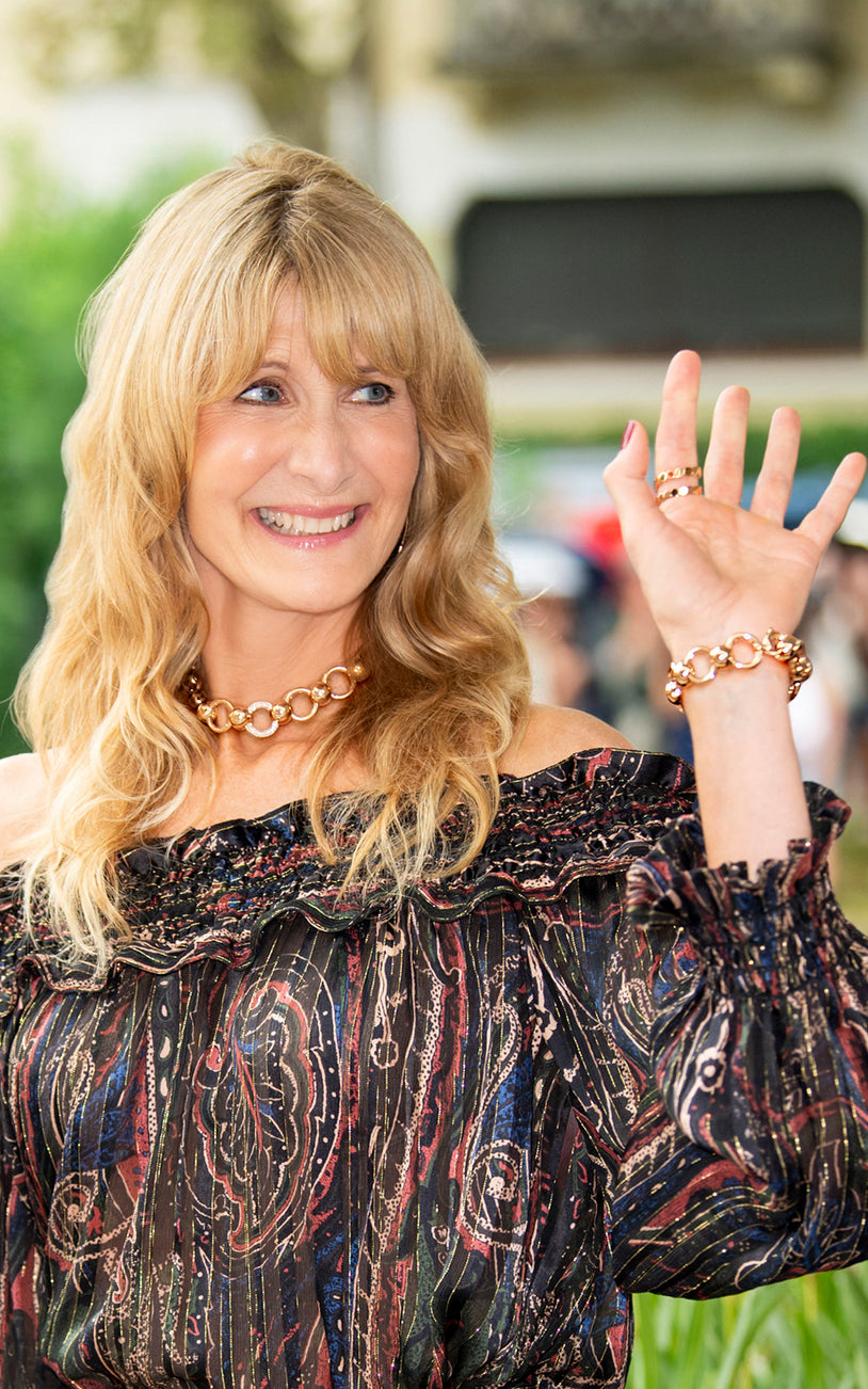 Laura Dern wearing a combination of our Luce collection: necklace, bracelet and ring in 18k Rose Gold.